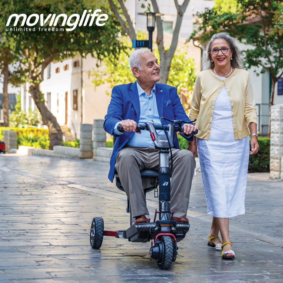 Happy couple with their Movinglife foldable mobility scooter